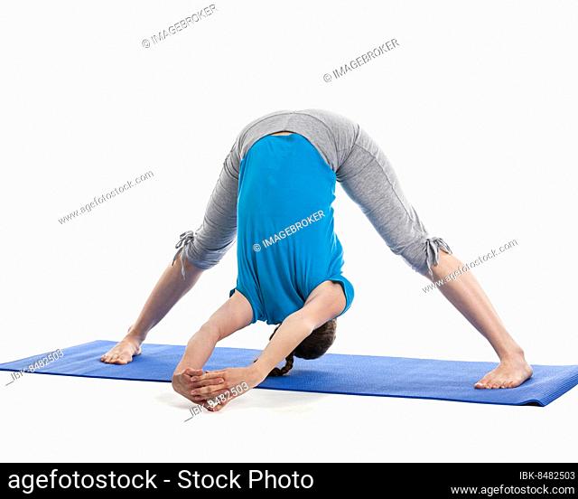 Yoga, young beautiful woman yoga instructor doing Wide Legged Forward Bend C pose (Prasarita Padottanasana C) exercise isolated on white background