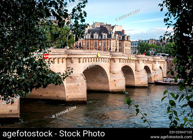 The famous Pont Neuf and the river Seine in Paris on a beautiful blue summer sky