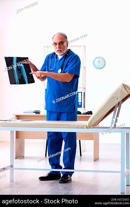 Senior male doctor radiologist working in the hospital