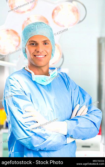 Hospital - Young male doctor or surgeon in a sterile operating room, theater or clean room of clinic