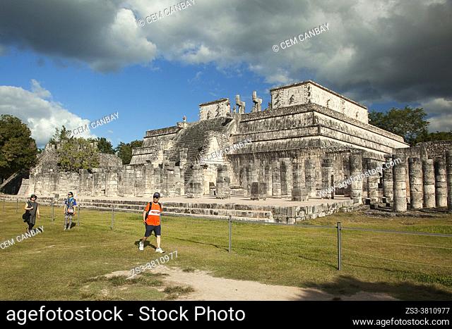 Tourists in front of the Temple Of The Warriors-Templo de los Guerreros at the Prehispanic Mayan Archaeological Site Chichen Itza in the Puuc Route