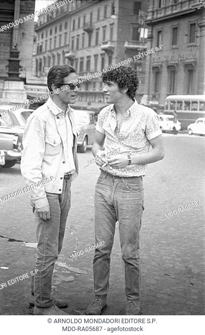 Italian writer and director Pier Paolo Pasolini talking to talian actor Ninetto Davoli on the set of the segment The sequence of the paper flower