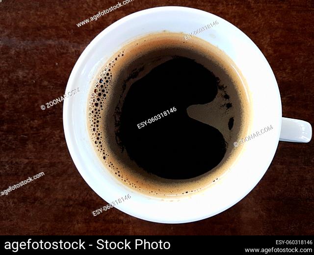 Black Coffee On Wooden Table Served In White Coffee Cup