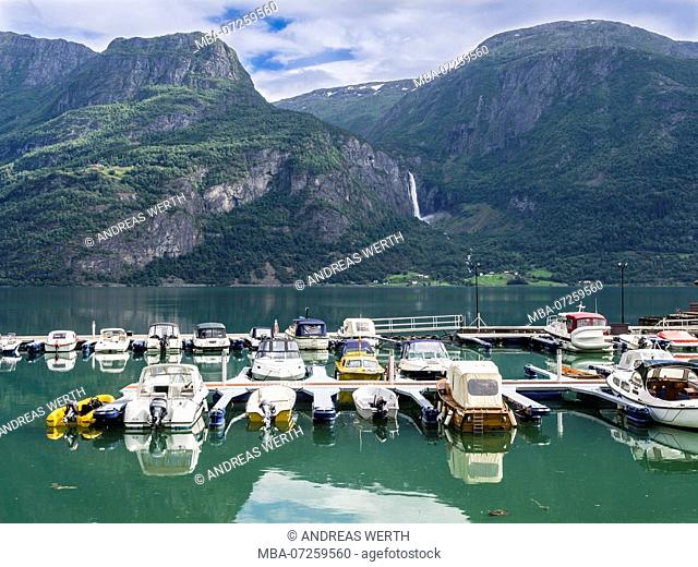Leisure boats tied at the Marina of village Høyheimsvik at the Lustrafjord, inner branch of the Sognefjord, , Norway