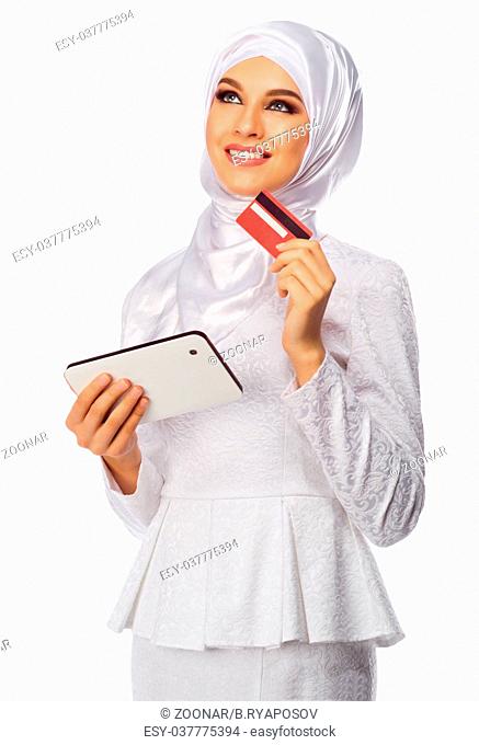 Muslim woman with tablet PC and card isolated