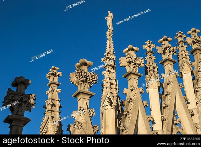 Ornate lattice work of pinnacles and spires adorning the Milan Cathedral. View from rooftop. Milan Cathedral (Duomo di Milano)