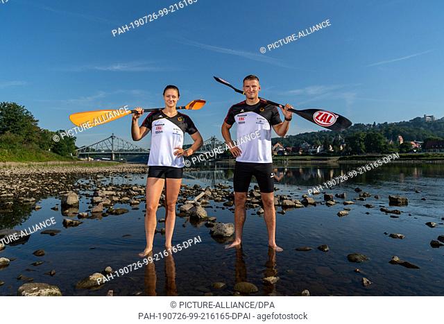 25 July 2019, Saxony, Dresden: Steffi Kriegerstein (l), Olympic silver medallist in canoeing and Tom Liebscher, Olympic champion in canoeing stand in front of...