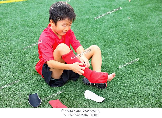 Japanese kid at soccer field