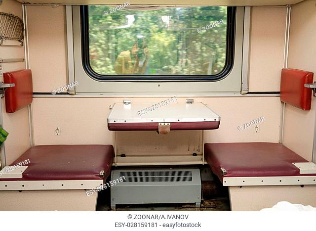 View of the empty seats in the lower second-class compartment wagon train