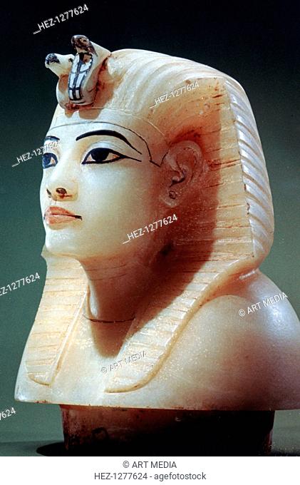 Stopper from one of the canopic urns from the tomb of Tutankhamun, 18th Dynasty. The head of the king is wearing the nemes, royal headdress