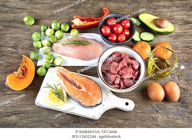 Various Paleo diet products on wooden table