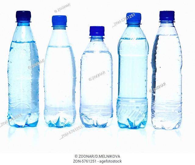 blue bottles with mineral water on white