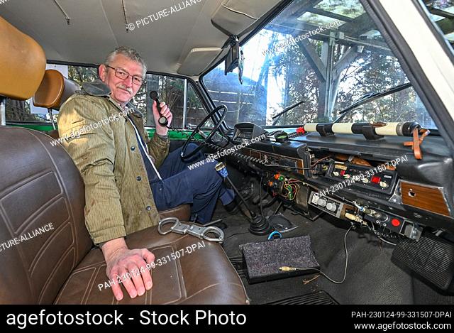 PRODUCTION - 19 January 2023, Brandenburg, Eggersdorf: Christian Paul, collector, sits in his Lada 2100S built in 1985, which was repainted in September 1990 by...