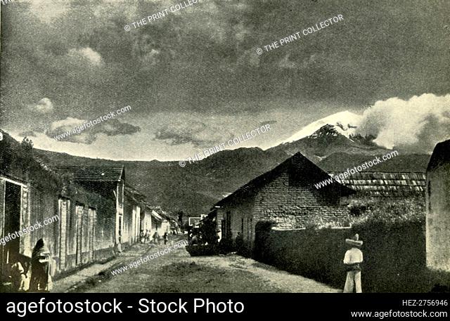 'Typical Side Street in Mexican Village: The Town of Ameca and Cloud-Effect on Popocatepetl', 1919. Creator: Unknown