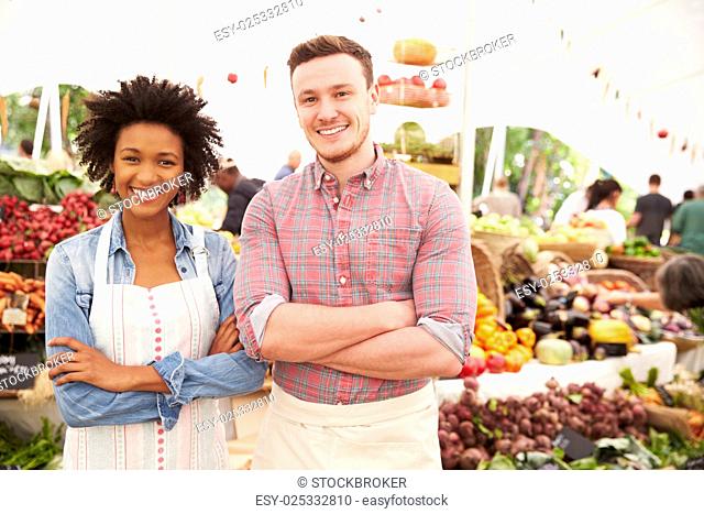 Couple Running Stall At Farmers Fresh Food Market