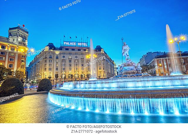Neptune fountain and the Palace hotel, located at the Paseo del Prado boulevard. Madrid, Spain