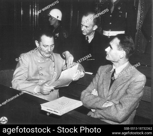 Defendants Huddle At Nuremberg -- Hermann Godering, Karl Doenitz and Rudolf Hess (Left to Right), Three of the Defendants in the war crimes trial of Big-Wig...
