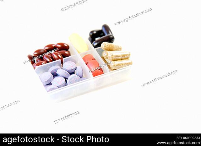 Pills and Capsules in a Container