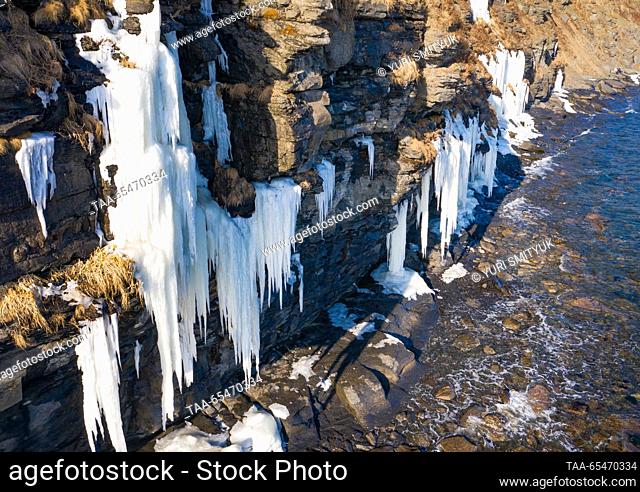 RUSSIA, VLADIVOSTOK - DECEMBER 4, 2023: A view of a rock covered with icicles in Bogdanovicha Bay of Russky Island. Yuri Smityuk/TASS
