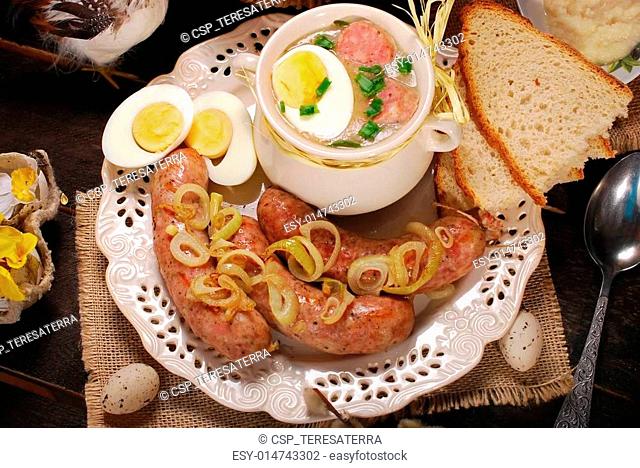 easter white borscht and sausage on rural wooden table