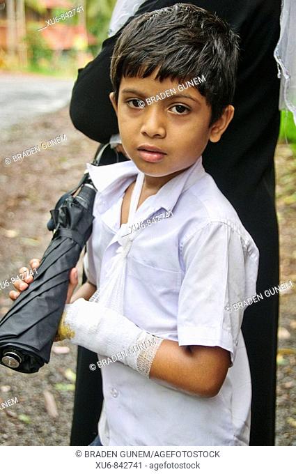 A young boy with a hut arm Kerala, India, Stock Photo, Picture And Rights  Managed Image. Pic. XU6-842741 | agefotostock