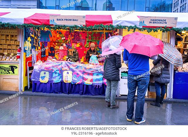 Shoppers browse the Union Square Holiday Market in New York on a rainy Saturday. 150 vendors, including a ''Made in Brooklyn'' section