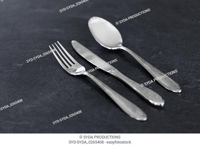 close up of fork, knife and spoon on table
