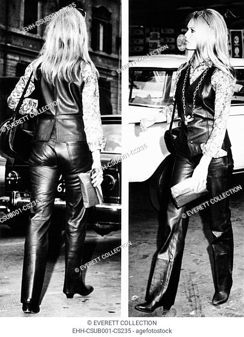 Brigitte Bardot wearing a striking leather suit as she strolls near the Spanish Steps in Rome. Brigitte and her husband, Gunther Sachs