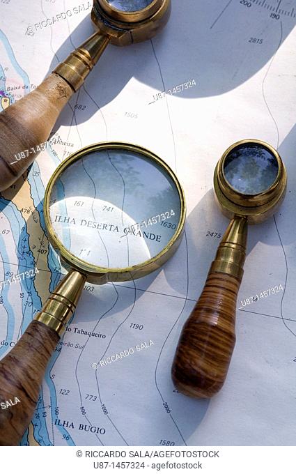 Still life of Map with Antique Magnifying Glass