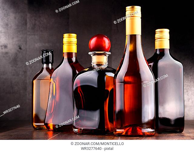 Composition with bottles of assorted alcoholic beverages