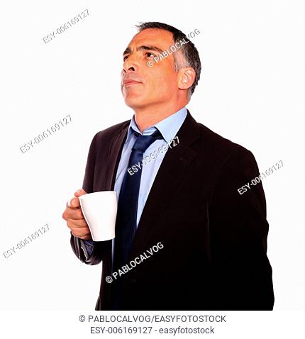 Portrait of a reflective business man with a white mug on isolated background