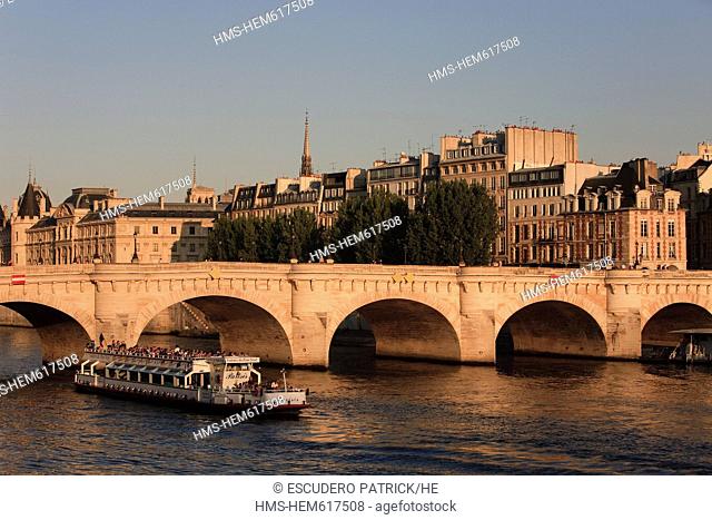 France, Paris, the Seine river banks, listed as World Heritage by UNESCO, a river boat passing by the Pont Neuf and the Ile de la Cite