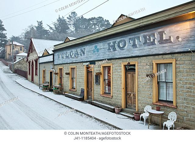 Vulcan Hotel, historic pub from goldfields era, during winter snow storm. St. Bathans, Central Otago, New Zealand