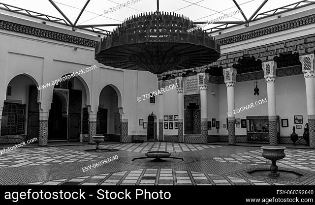 A black and white picture of a large room in the Museum of Marrakech