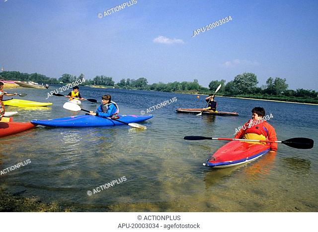 Teens kayaking on a river