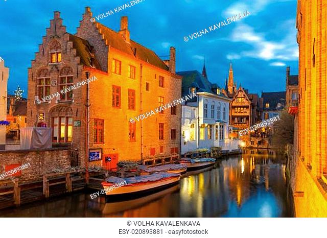 Cityscape with the picturesque night canal Dijver in Bruges