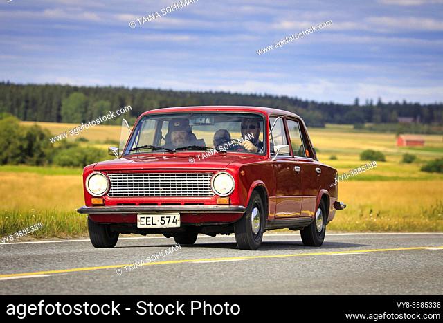 Driving red Lada 1200 on Maisemaruise 2019 car cruise. Lada 1200 was manufactured by the Russian AvtoVAZ in 1970-88. Vaulammi, Finland. Aug 3, 2019