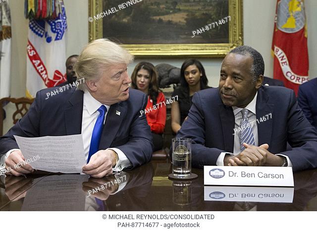 United States President Donald J. Trump (L) speaks beside his nominee to lead the Department of Housing and Urban Development (HUD) Ben Carson (R)