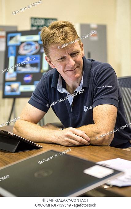 European Space Agency astronaut Timothy Peake, Expedition 4647 flight engineer, prepares for a training session in the Cupola trainer in the systems engineering...