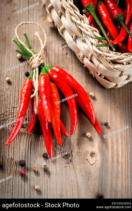 Pods of red pepper in a wicker basket
