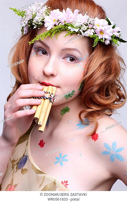redhead girl with panflute