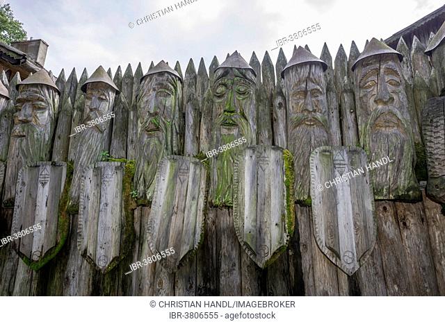 Wooden warrior figures at the entrance, Mazurski Eden or Masurian Garden of Eden, reconstruction of Galindian culture, Gmina Ruciane-Nida