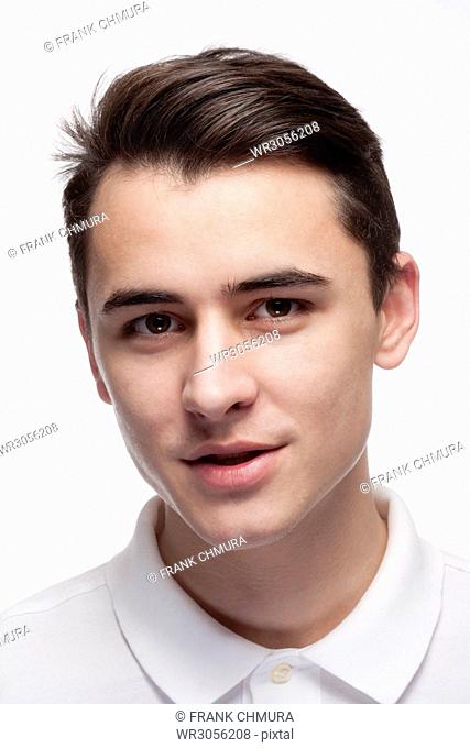 Studio Portrait of a Teenage Boy in White Shirt