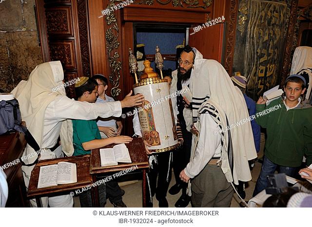 Bar Mitzvar, Jewish coming of age ritual, the Torah scroll is returned to the Torah cabinet, its back resting against the Western Wall or Wailing Wall