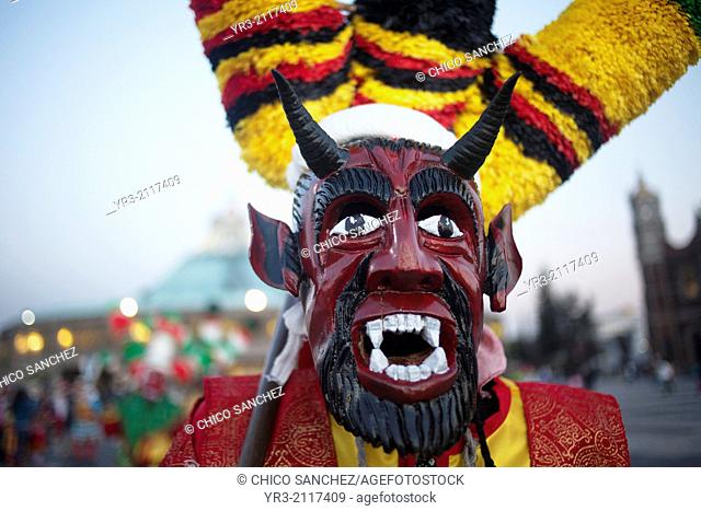 A dancer from Chocaman, Veracruz, dressed as a red devil, dances the Danza de los Santiagos at the pilgrimage to Our Lady of Guadalupe Basilica in Mexico City