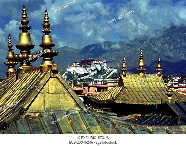 View from Jokhang Temple golden rooftops toward The Potala Palace in the distance