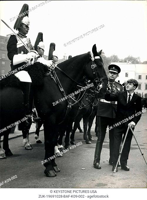 Oct. 28, 1969 - A different kind of Escort for the Household Cavalry: Ian Brown, a 14-year-old pupil at the Woodlands School for physically Handicapped children...
