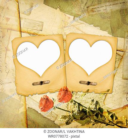 Old grunge paper frame with heart on the ancient background