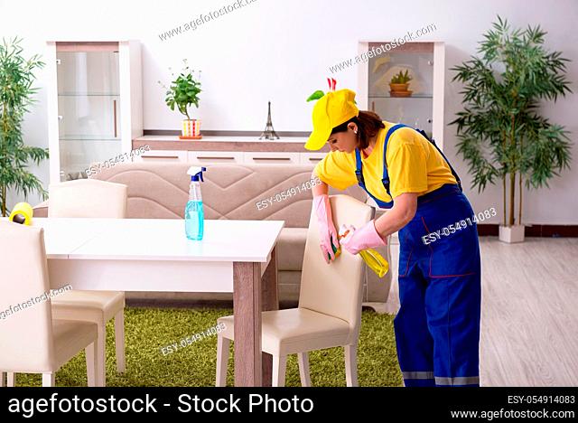 Old female contractor doing housework