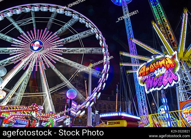 Dam Square Fun Fair Carnival rides at night, Amsterdam, North Holland, Netherlands